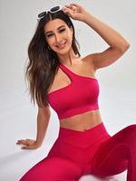 Completo sportivo senza cuciture con canotta a scollo asimmetrico monocolore e pantaloni lunghi