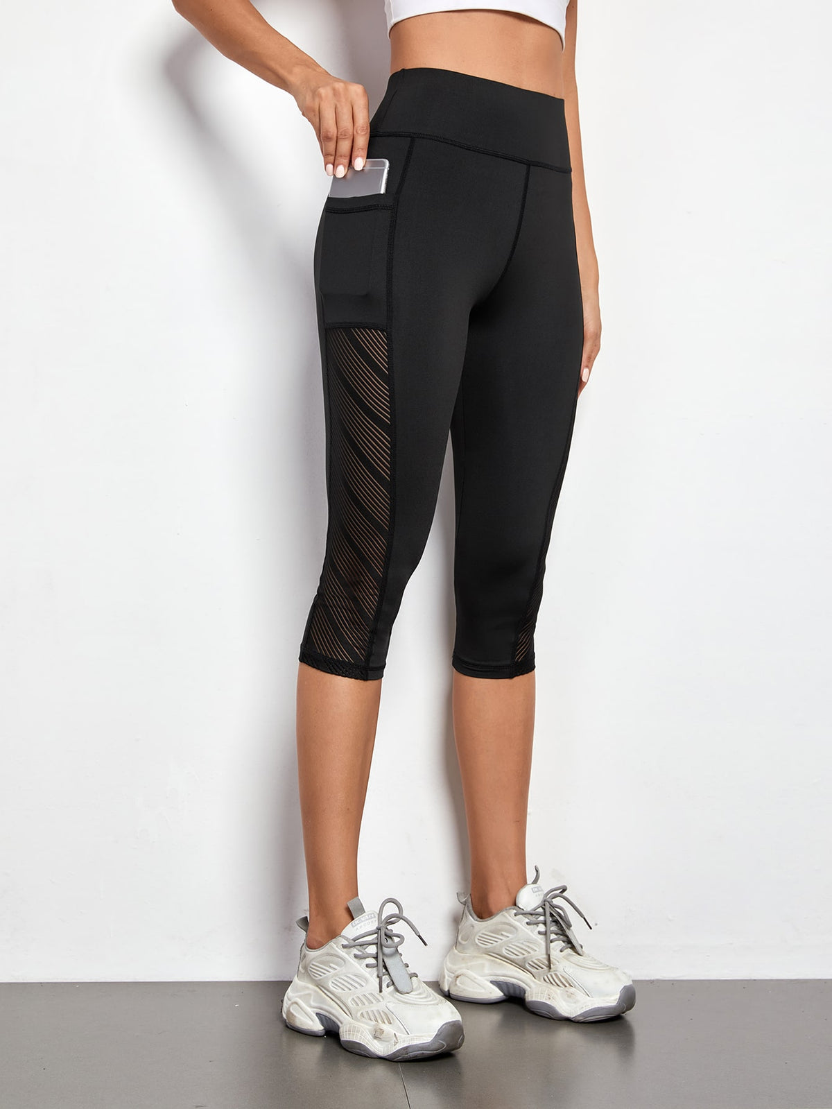 Leggings sportivi a fascia larga con tasca per telefono