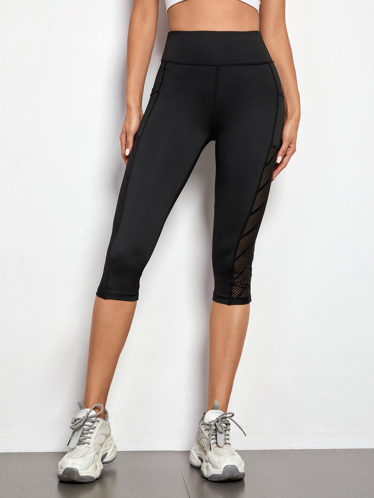 Leggings sportivi a fascia larga con tasca per telefono