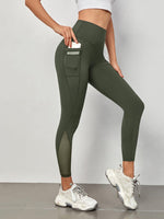 Leggings sportivi a fascia larga in maglia a contrasto con tasca per telefono