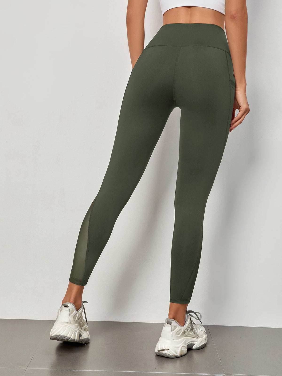 Leggings sportivi a fascia larga in maglia a contrasto con tasca per telefono