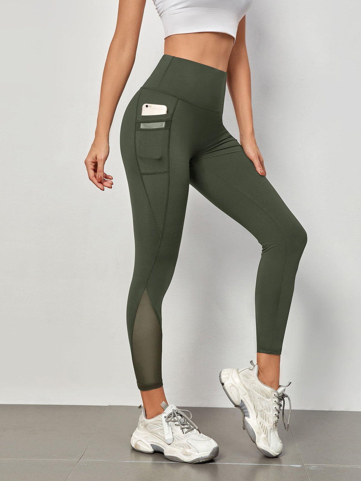 Leggings sportivi a fascia larga in maglia a contrasto con tasca per telefono