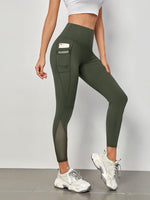 Leggings sportivi a fascia larga in maglia a contrasto con tasca per telefono