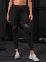 Leggings da yoga corti Collant da palestra in rete a contrasto con controllo di pancia con tasca laterale per telefono