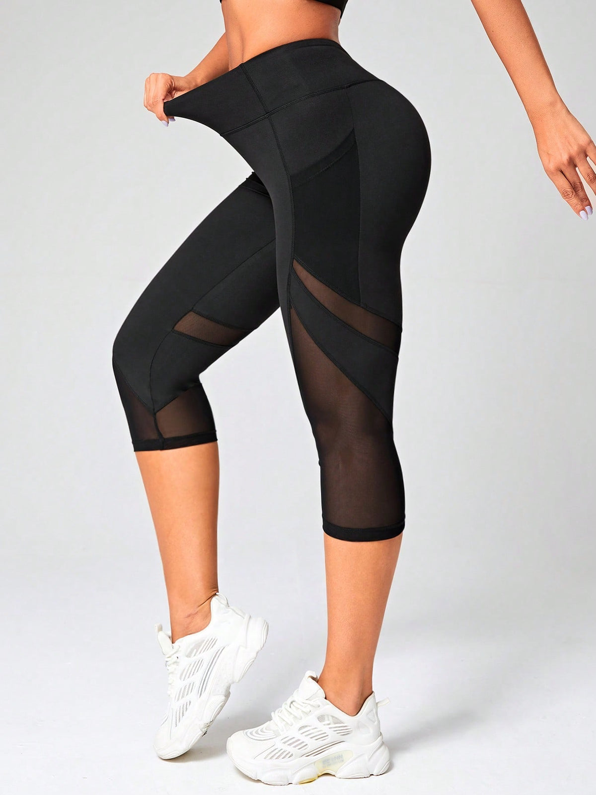 Leggings sportivi Capri tulle a contrasto con tasca del telefono