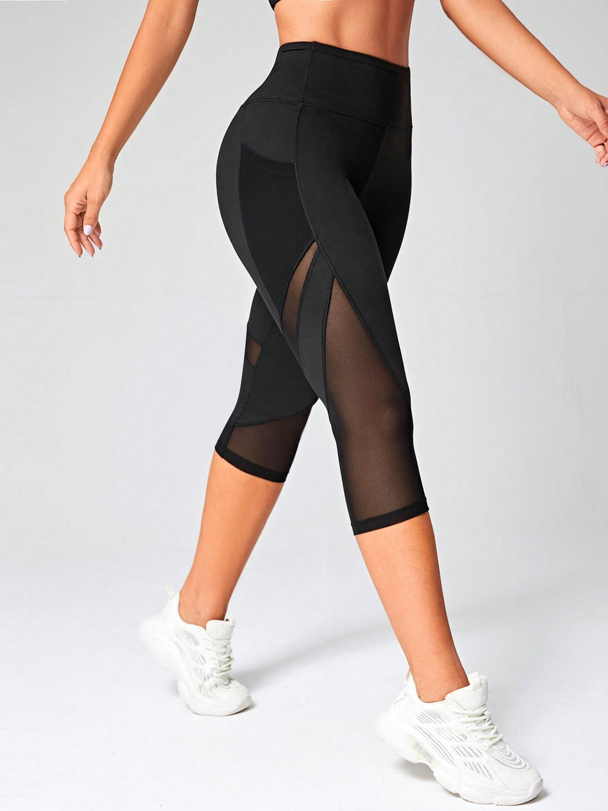 Leggings sportivi Capri tulle a contrasto con tasca del telefono