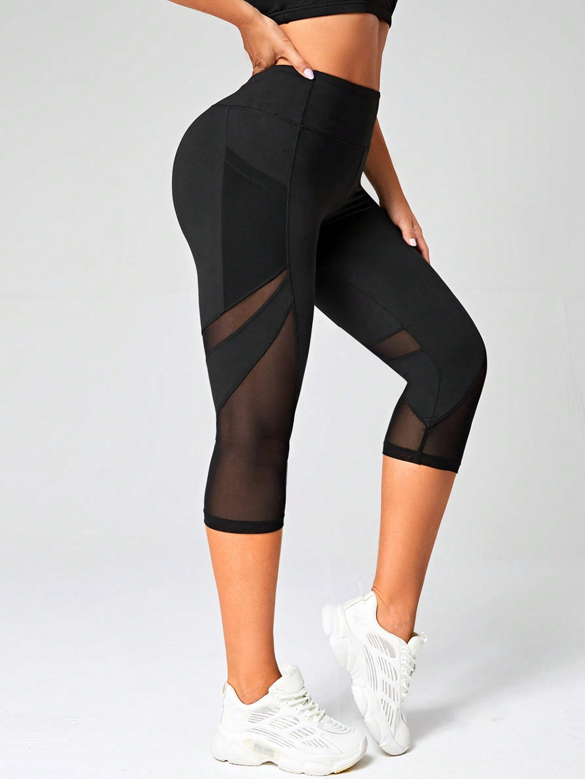 Leggings sportivi Capri tulle a contrasto con tasca del telefono