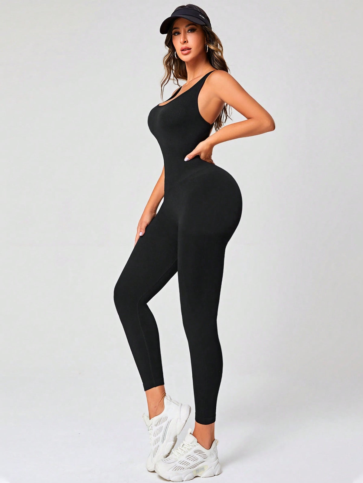 Jumpsuit sportiva schienale incrociato monocolore