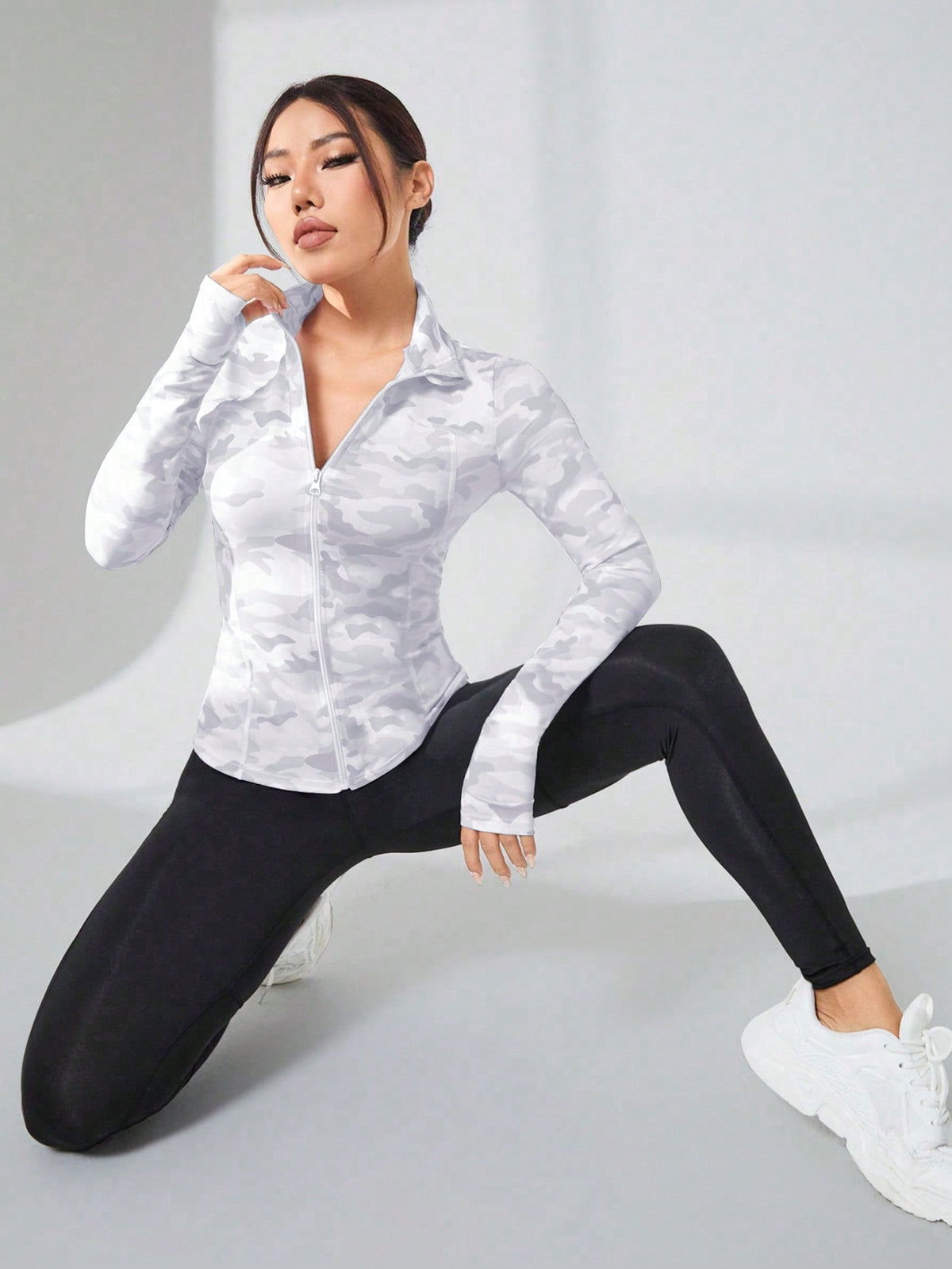 Giacche sportive con stampa mimetica fori per pollici con zip frontale