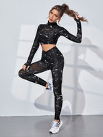 Tshirt sportiva a maniche corte con stampa grafica e schienale scoperto, e leggings in contrasto con inserti in rete