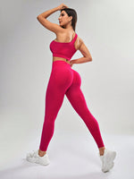 Completo sportivo senza cuciture con canotta a scollo asimmetrico monocolore e pantaloni lunghi