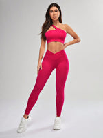 Completo sportivo senza cuciture con canotta a scollo asimmetrico monocolore e pantaloni lunghi