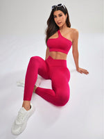 Completo sportivo senza cuciture con canotta a scollo asimmetrico monocolore e pantaloni lunghi