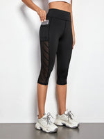 Leggings sportivi a fascia larga con tasca per telefono