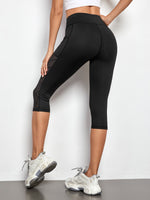 Leggings sportivi a fascia larga con tasca per telefono