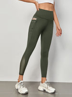 Leggings sportivi a fascia larga in maglia a contrasto con tasca per telefono